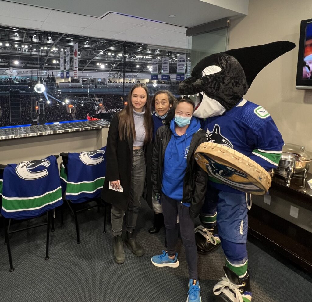 Roen Family Goes for a Canucks game and take picture with Fin, the mascot